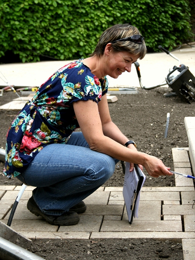 Sophia inspecting the stonework for the Persian Garden bespoke ponds and rill made from individually designed stone pieces.
